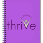 licensed to thrive logo on a journal